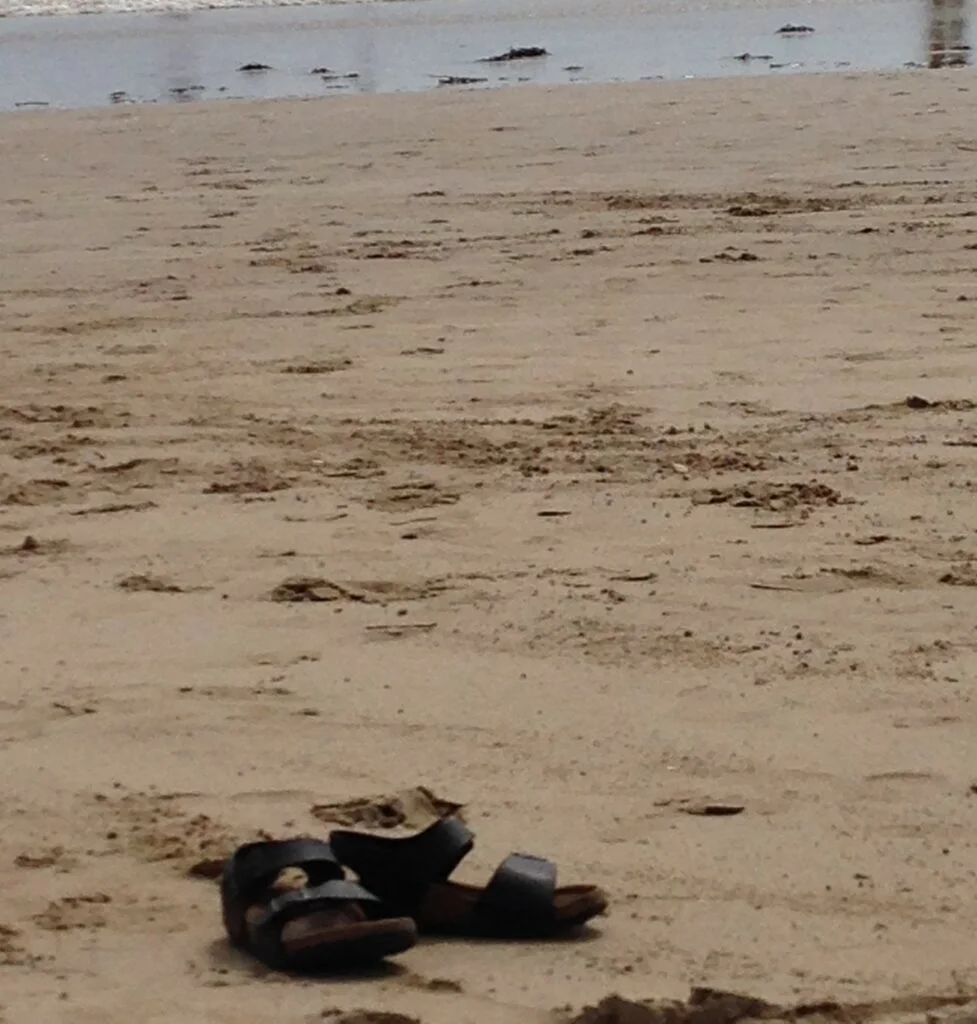 child-shoes-on-the-beach